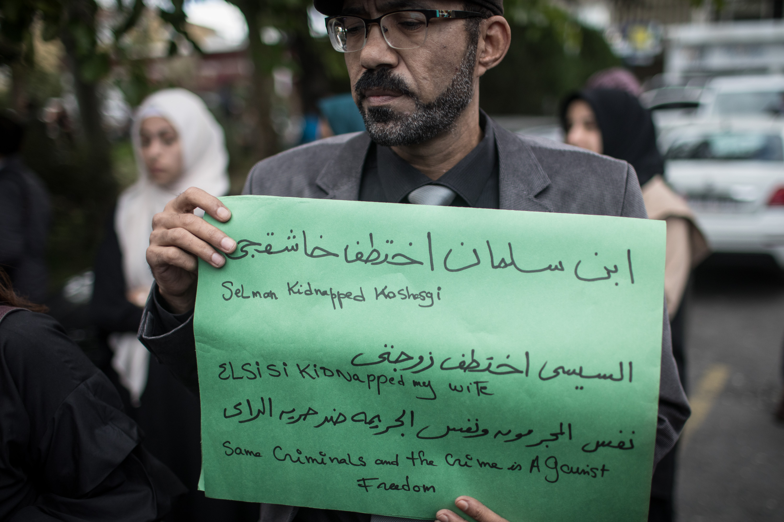 A man holds a poster during a protest organized by members of the Turkish-Arabic Media Association at the entrance to Saudi Arabia's consulate on October 8th, 2018, in Istanbul, Turkey. Fears are growing over the fate of missing journalist Jamal Khashoggi after Turkish officials said they believe he was murdered inside the Saudi consulate. Saudi consulate officials have said that Khashoggi went missing after leaving the consulate. However, the statement directly contradicts other sources, including Turkish officials.