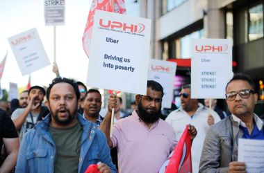 Uber drivers march to Uber's offices in London on October 9th, 2018, with placards and banners from the various trade unions.