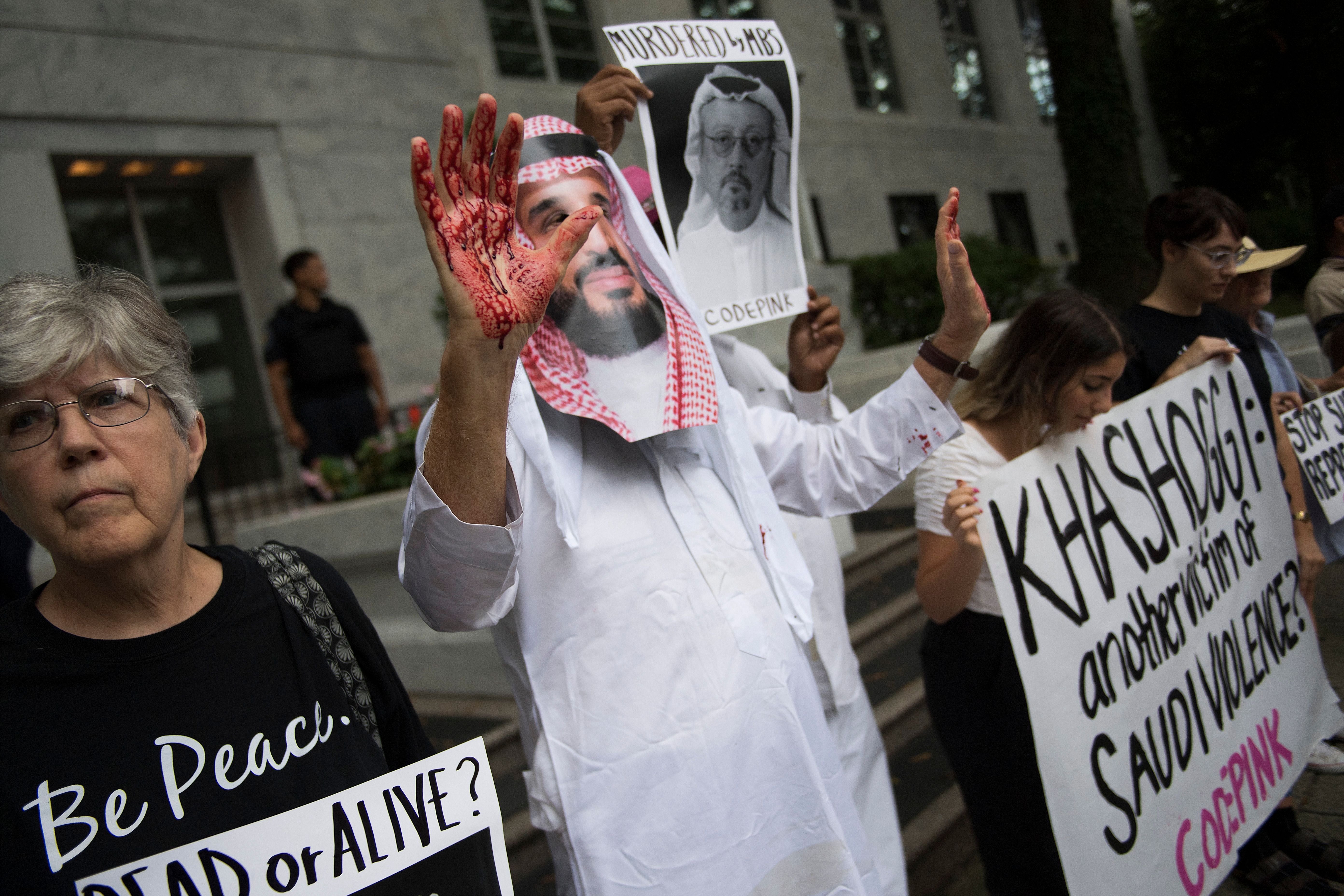 A demonstrator dressed as Saudi Arabian Crown Prince Mohammed bin Salman with blood on his hands protests outside the Saudi Embassy in Washington, D.C., on October 8th, 2018, demanding justice for missing Saudi journalist Jamal Khashoggi. U.S. President Donald Trump said on October 10th that he has talked to Saudi authorities 