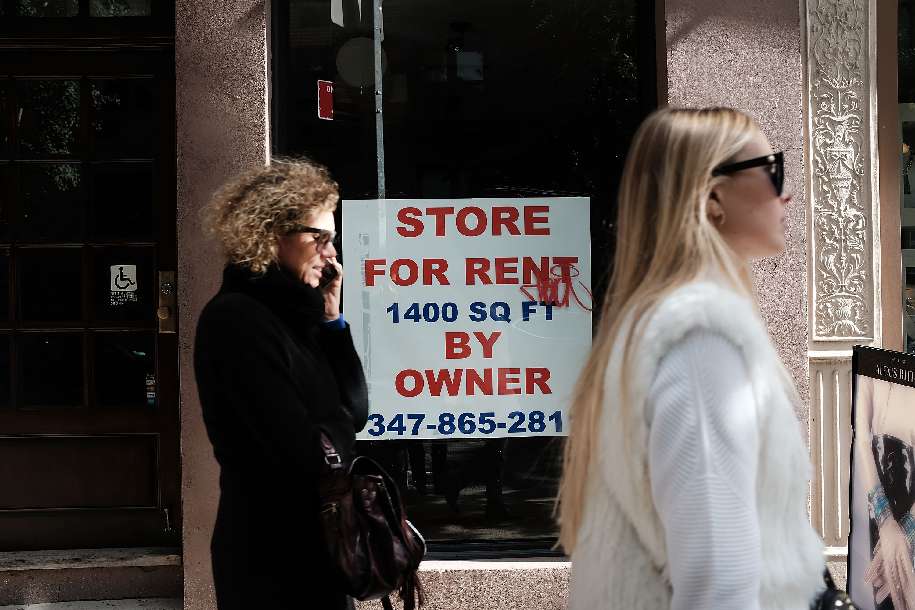 A sign in a window advertises an empty store for rent in the West Village of Manhattan on October 16th, 2018, in New York City. Manhattan, one of the world's top retail destinations, has been experiencing a wave of retail store closures over the past few years.