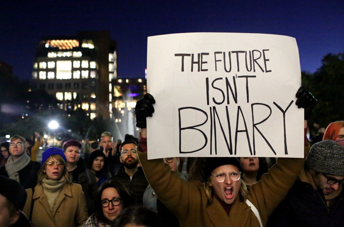 People gather at a rally for LGBTQ rights at Washington Square Park on October 21st, 2018, in New York City. Based on a leaked memo, the New York Times had reported that morning that the Trump administration is considering redefining gender as a "biological, immutable condition determined by genitalia at birth," which activists say would subject transgender and gender non-conforming people to discrimination, harassment, and violence.