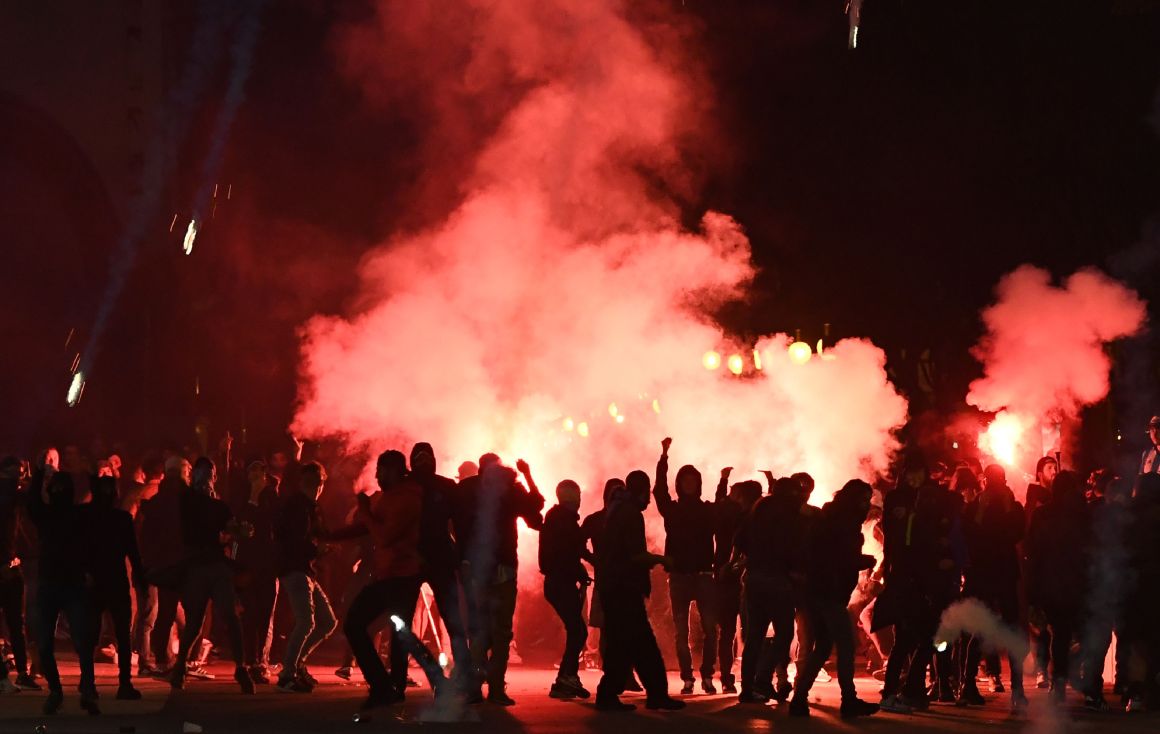 Tear gas envelops Marseille football supporters during clashes with French security officials on a street in Marseille, France, on October 25th, 2018, ahead of a match with Italian club Lazio. The two teams, both known for some of the most intense fans in football, played a Union of European Football Associations Europa League match in the Mediterranean city. Fans set off flares in the street; police responded in full riot gear with pepper spray and tear gas.