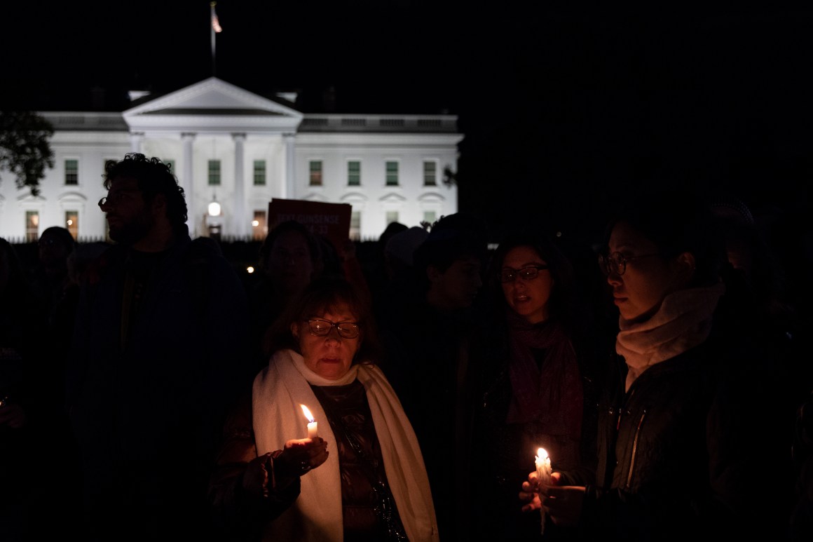 Vigil participants hold candles and sing a Jewish prayer in front of the White House on October 27th, 2018, during a vigil for the victims of the Tree of Life Congregation shooting.