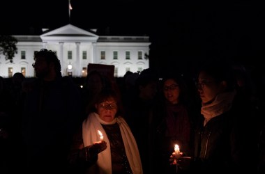 Vigil participants hold candles and sing a Jewish prayer in front of the White House on October 27th, 2018, during a vigil for the victims of the Tree of Life Congregation shooting.