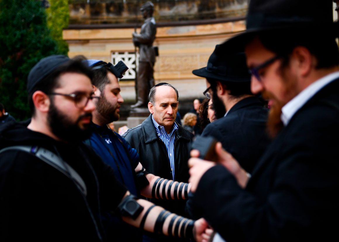 People arrive for a vigil at the Allegheny County Soldiers Memorial in Pittsburgh, Pennsylvania, on October 28th, 2018, to commemorate the victims of the shooting at the Tree of Life synagogue.