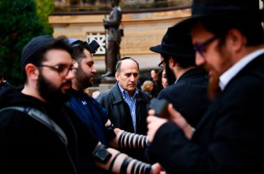 People arrive for a vigil at the Allegheny County Soldiers Memorial in Pittsburgh, Pennsylvania, on October 28th, 2018, to commemorate the victims of the shooting at the Tree of Life synagogue.