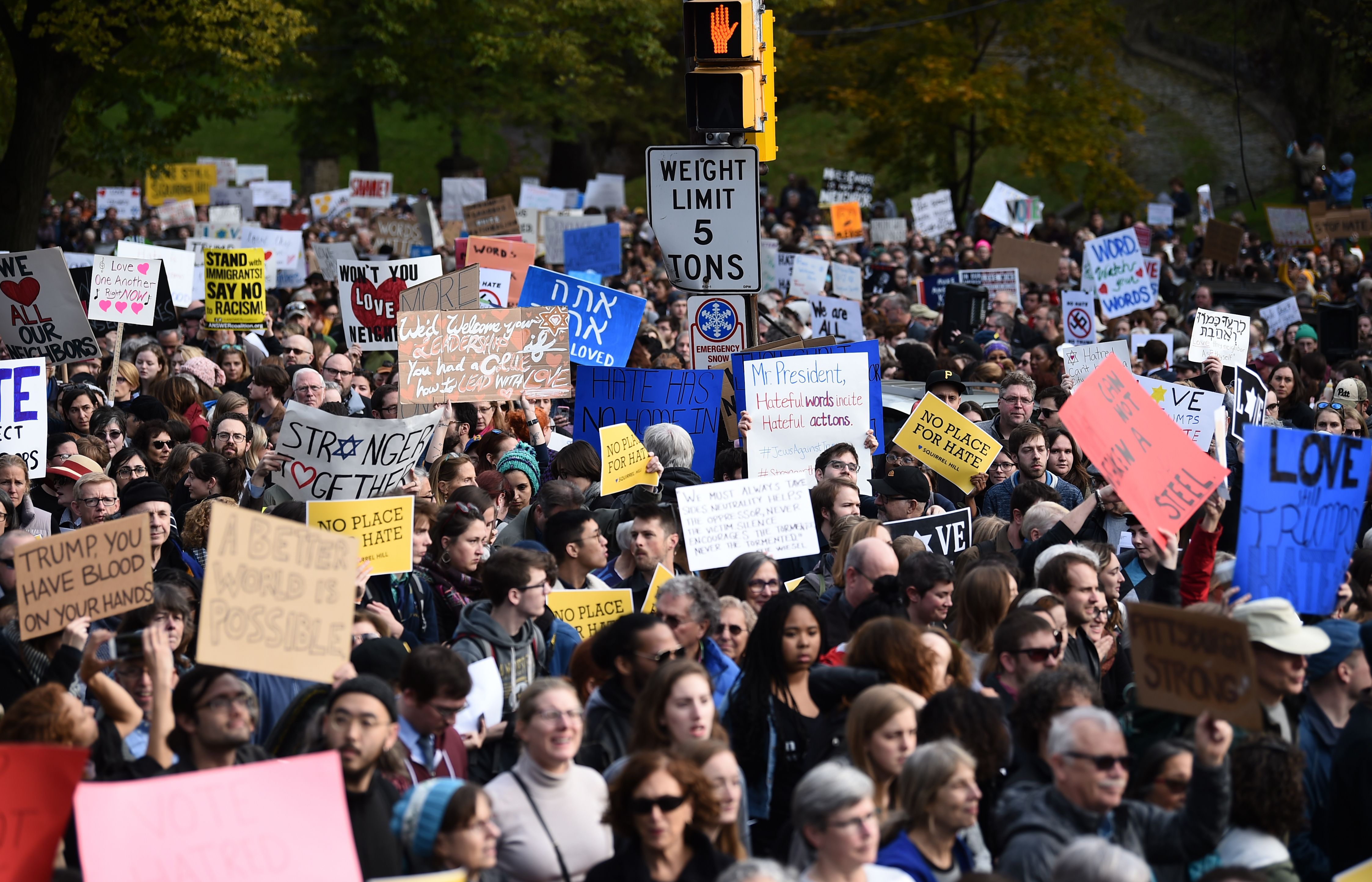 Scores of protesters took to the streets of Pittsburgh to denounce a visit by U.S. President Donald Trump in the wake of a mass shooting at a synagogue that left 11 people dead. Demonstrators gathered near the Tree of Life synagogue, where the shooting took place, holding signs that read 