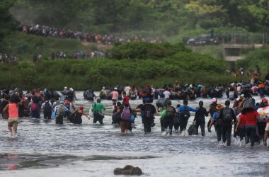 Salvadorean migrants heading in a caravan to the U.S., cross the Suchiate River to Mexico.