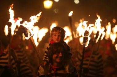 Revelers parade through the streets of Lewes in East Sussex, southern England, on November 5th, 2018, during traditional Bonfire Night celebrations. Thousands of people attended the annual parade through the narrow streets until the evening came to an end with the burning of an effigy or "guy," usually representing Guy Fawkes, who died in 1605 after an unsuccessful attempt to blow up the Houses of Parliament.