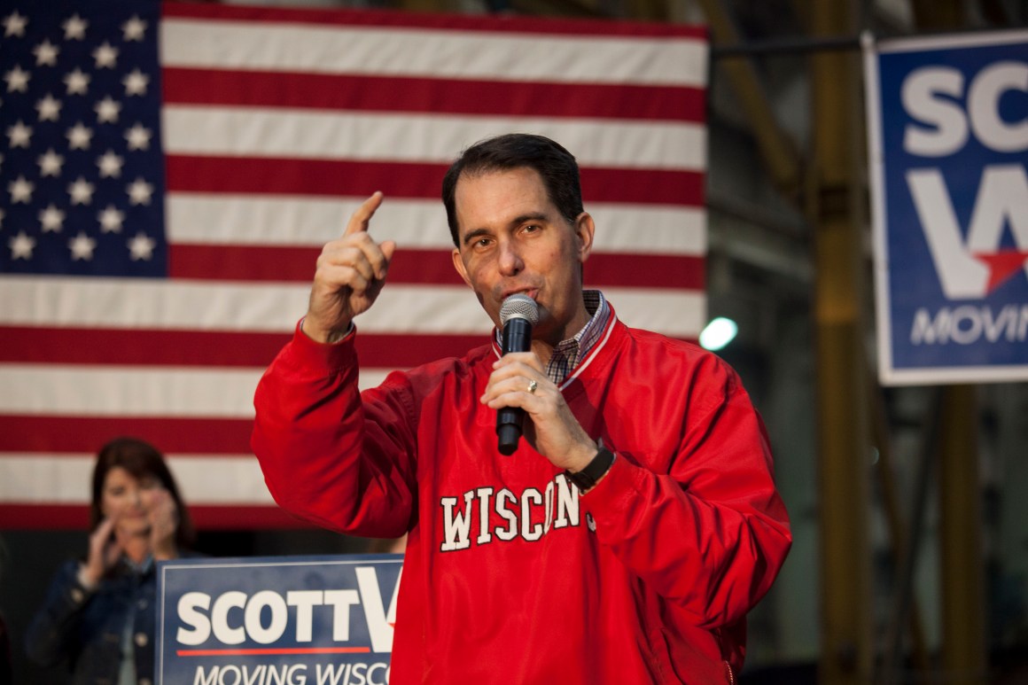 Governor Scott Walker speaks to supporters at a last-minute rally the night before the mid-term elections on November 5th, 2018, in Waukesha, Wisconsin.