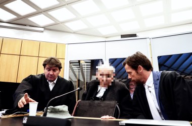 Defendant Dr. Johann R., whose face is pixelated by court order, sits with his lawyers at a session of his trial at the Regional Court in Muenster, Germany, on November 6th, 2018. The 94-year-old former SS guard faces trial, charged with complicity in the mass murders at the Nazi concentration camp Stutthof during World War II. Johann R. was a watchman at the Nazi camp near what was then the free city of Danzig, now Gdansk, in Poland. He also stands accused of complicity in the murders of several hundred camp prisoners between 1942 and 1945. As the former SS guard was not yet 21 at the time of the crimes, he will be tried before a juvenile court.