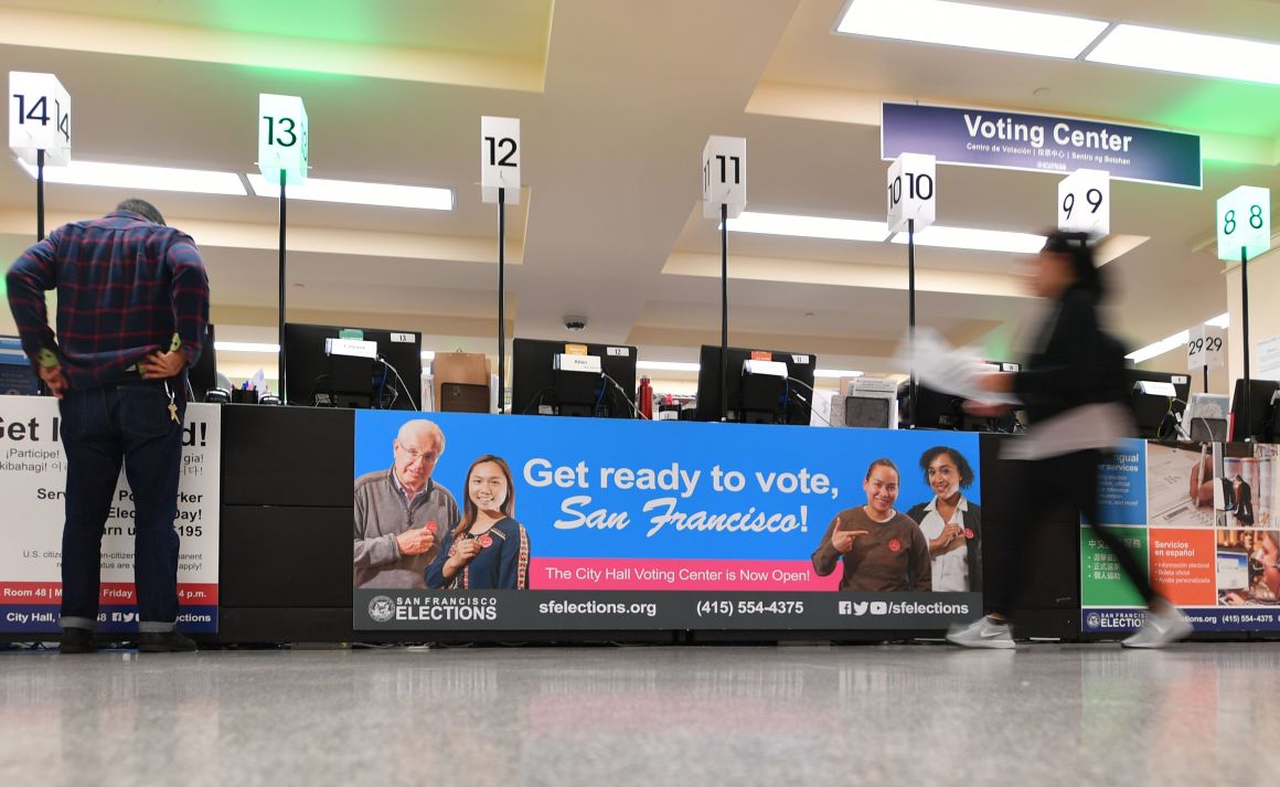 People vote at city hall in San Francisco, California, in the 2018 mid-term election.