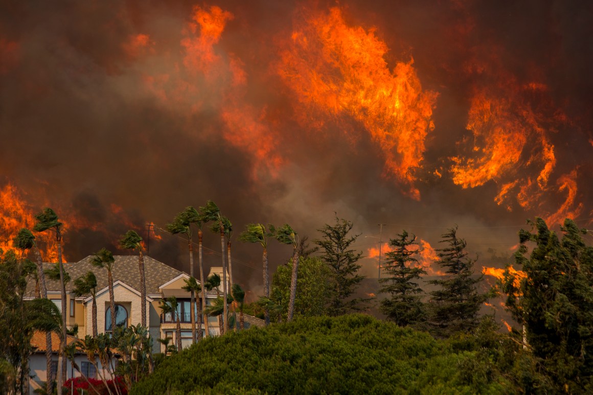 The Woolsey fire approaches homes on November 9th, 2018, in Malibu, California.