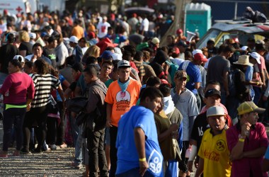 Central American migrants, taking part in a caravan heading to the U.S., queue to receive a meal at a temporary shelter in Irapuato, Guanajuato state, Mexico.