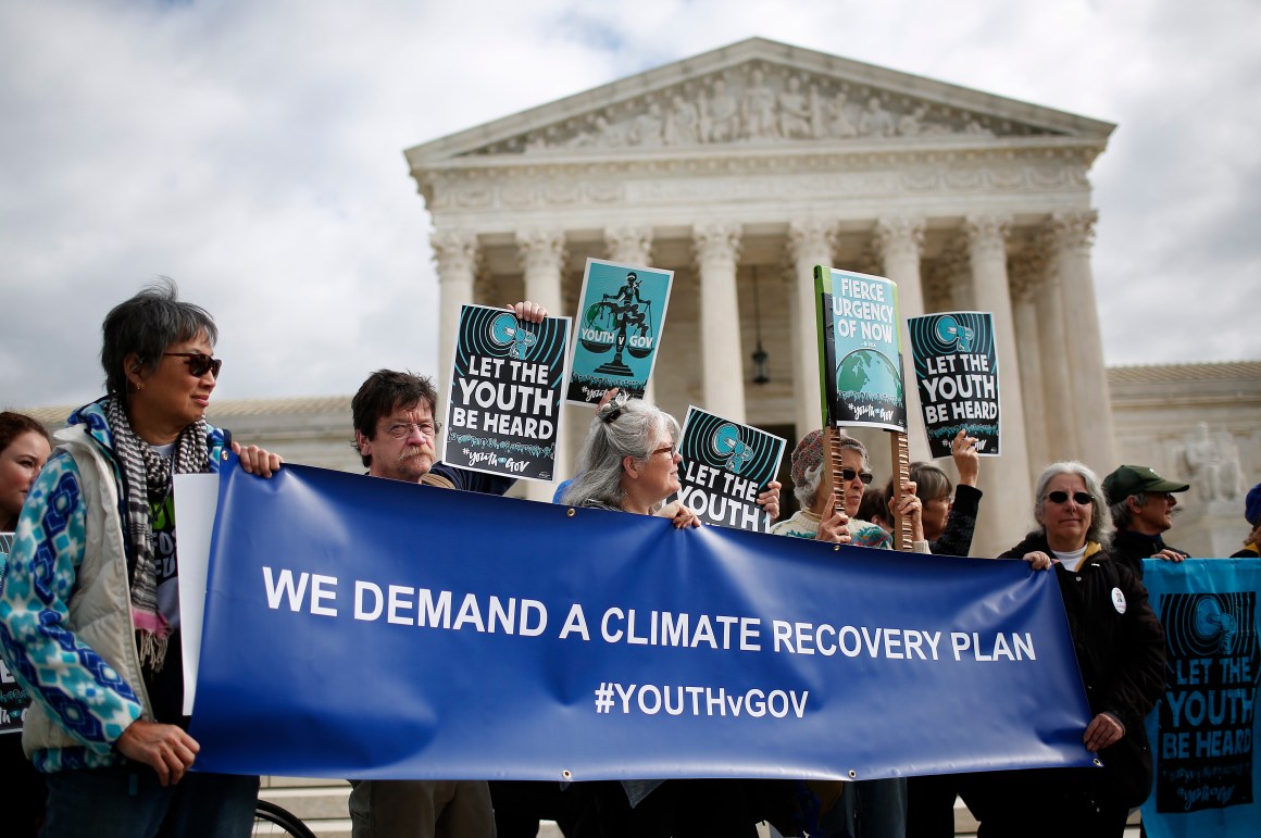 Protesters attend a rally held by the group Our Children's Trust on October 29th, 2018, outside the United States Supreme Court in Washington, D.C. The group rallied in support of the Juliana v. U.S. lawsuit brought on behalf of 21 youth plaintiffs that argues the U.S. government has violated constitutional rights for more than 50 years by contributing to climate change.