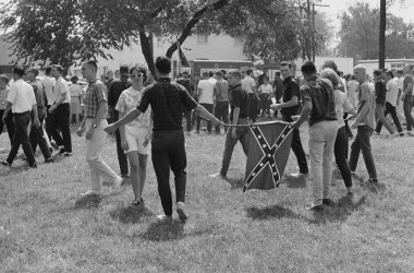 A crowd of students in Birmingham, Alabama, flying the Confederate flag in opposition to the start of the Birmingham Campaign in May of 1963.