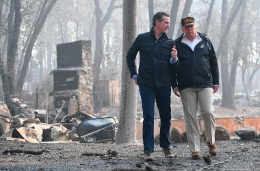 President Donald Trump speaks with Gavin Newson, who was lieutenant governor of California at the time, as they view damage from the Camp fire in Paradise, California, on November 17th, 2018.