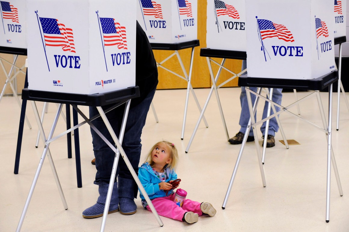 Allyson Webb watches her mother, Angela Webb vote at the Gilpin County Community Center on November 2nd, 2010, outside of Central City, Colorado.