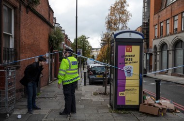 On November 7th, 2018, a police officer lets a member of the public out of a crime scene near "Billy Fury Way," where a teenager was stabbed the previous evening in London, England. The incident comes amid a wave of knife-related incidents that has seen the deaths of five people in the last six days. The boy is reported to be in a critical condition. Scotland Yard Commander Stuart Cundy said additional police officers were being deployed in every borough after a "terrible" few days.