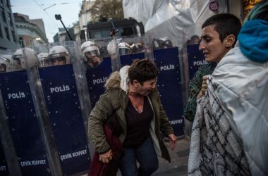 ProtestErs react after Turkish anti-riot police used tear gas against women's rights activists marching to protest against gender violence in Istanbul, on November 25th, 2018, on the International Day for the Elimination of Violence Against Women.