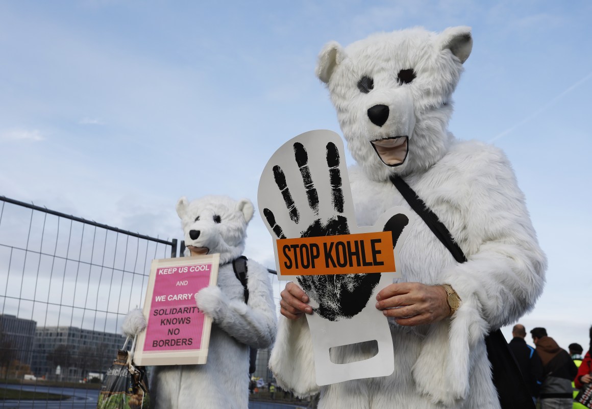 Activists hold placards and shout slogans against the energy policy of the German government during an anti-coal protest on December 1st, 2018, in Berlin, Germany. Protests took place in Berlin and Cologne ahead of the U.N. COP24 climate conference in Katowice, Poland.