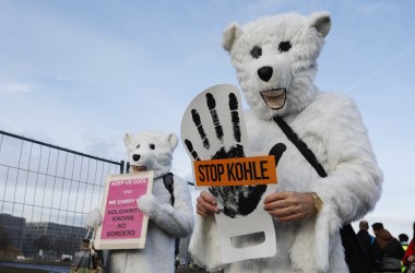 Activists hold placards and shout slogans against the energy policy of the German government during an anti-coal protest on December 1st, 2018, in Berlin, Germany. Protests took place in Berlin and Cologne ahead of the U.N. COP24 climate conference in Katowice, Poland.