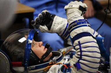 NASA astronaut Anne McClain reacts as her space suit is tested prior to the launch onboard the Soyuz MS-11 spacecraft at the Russian-leased Baikonur cosmodrome in Kazakhstan on December 3rd, 2018.