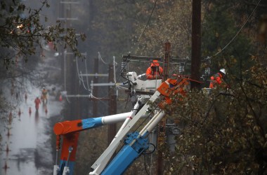 PG&E crews repair power lines that were destroyed by the Camp Fire on November 21st, 2018, in Paradise, California.