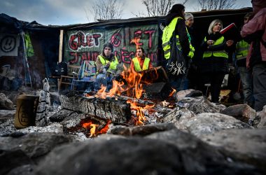 "Yellow vest" protesters occupy a traffic circle on December 11th, 2018, in Saint-Etienne, France. Although the president offered a financial relief package to quell the revolt, some demonstrators said they were not ready to call a halt to the protests.