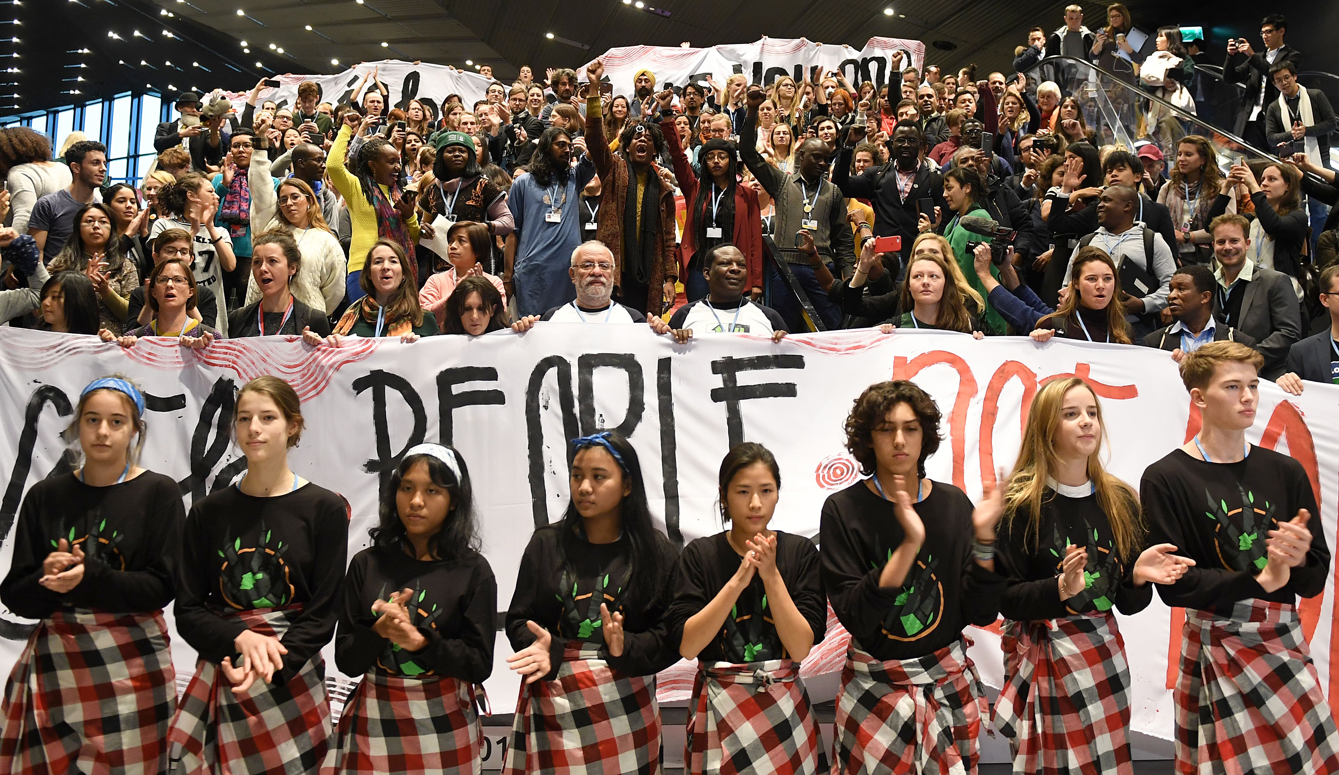 Members of the Global Campaign to Demand Climate Justice protest ahead of the final session of COP24 in Katowice, Poland, on December 14th, 2018.