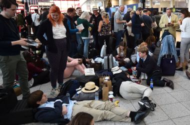 Passengers wait at the North Terminal at London Gatwick Airport, south of London, on December 20th, 2018, after all flights were grounded due to drones flying over the airfield.