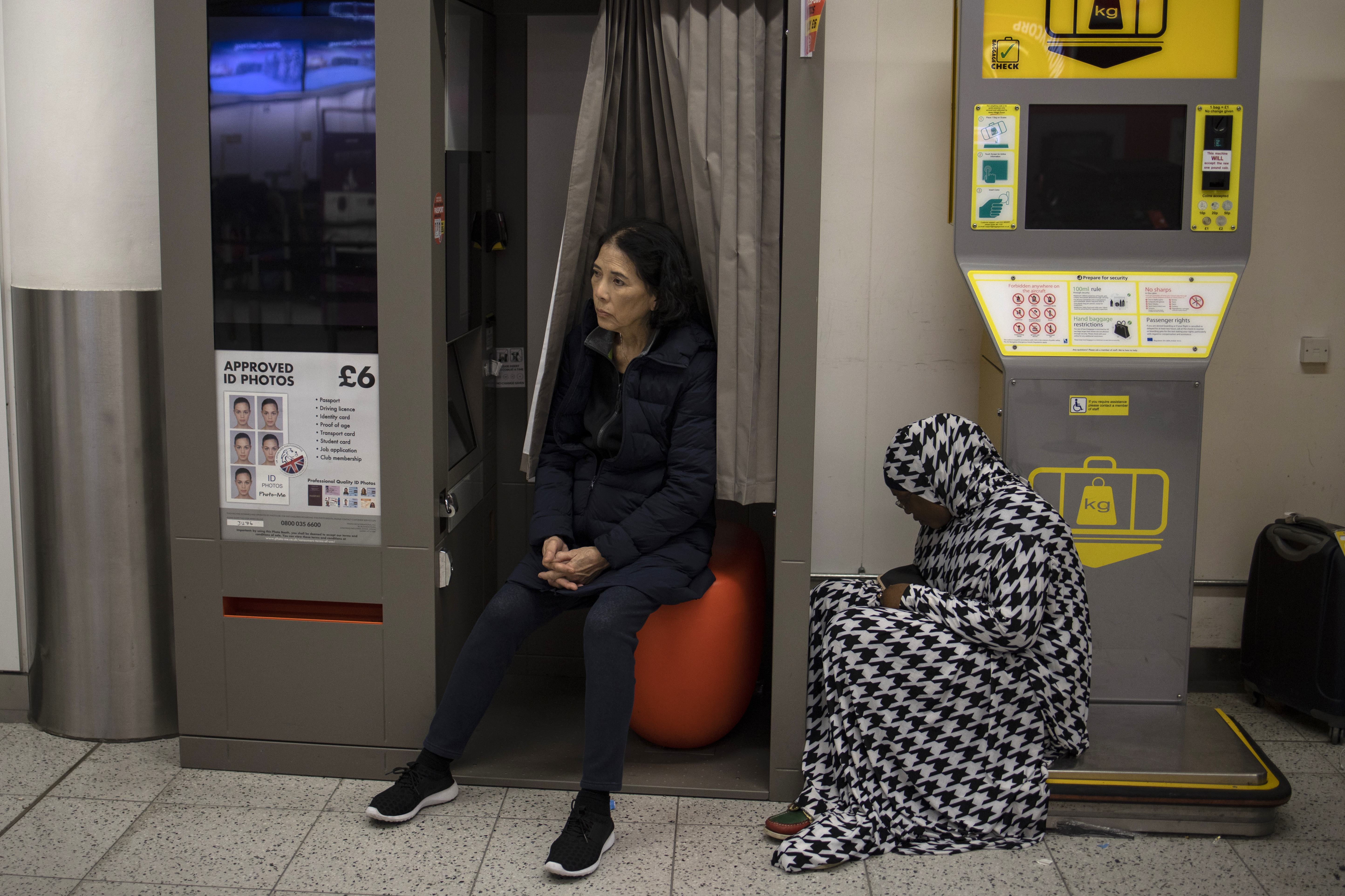 Passengers wait for announcements at Gatwick South Terminal on December 20th, 2018.