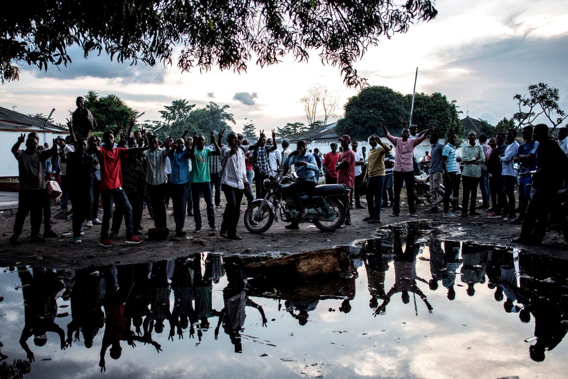 Supporters of the Democratic Republic of the Congo's Union for Democracy and Social Progress party demonstrate outside the party headquarters in Kinshasa on December 20th, 2018, to protest against the postponed elections. The DRC's troubled journey to elect a successor to the incumbent president hit a new snag on December 20th, three days before voting, as electoral supervisors ordered a week-long postponement after a fire destroyed polling equipment.