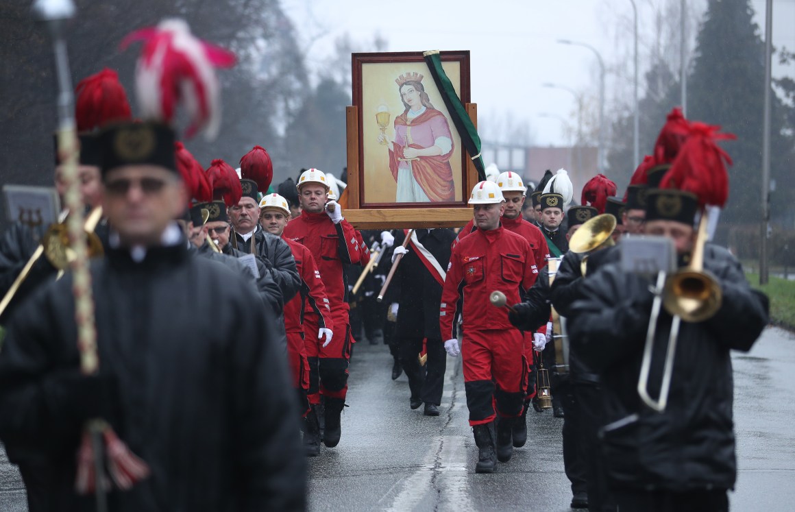 Coal miners from Poland's Pniowek coal mine carry a painting of Saint Barbara on Barbórka, their annual day of tribute to Barbara, from the mine to their local church on December 4th, 2018, in Pawlowice, near Wodzislaw Slaski, Poland. Barbara is the patron saint of coal miners, and every December 4th, miners across Poland celebrate her with a march, a religious mass, and a festive gathering. Coal provides about 80 percent of Poland's electricity. The mines, many of them in the region of Silesia in southern Poland, employ tens of thousands of workers. Meanwhile, the United Nations' COP 24 climate conference is taking place in nearby Katowice.