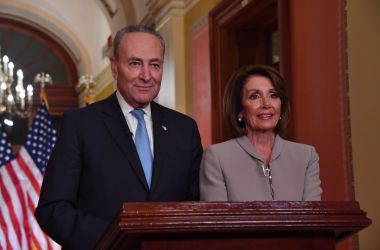 House Speaker Nancy Pelosi and Senate Democratic leader Chuck Schumer pose for pictures after delivering a response to President Donald Trump's televised address to the nation on border funding at the Capitol in Washington, D.C., on January 8th, 2019.