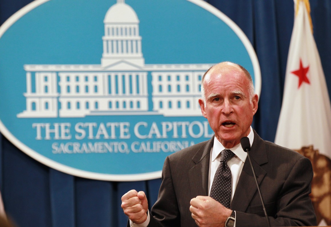 California Governor Jerry Brown speaks to reporters at the California State Capitol.