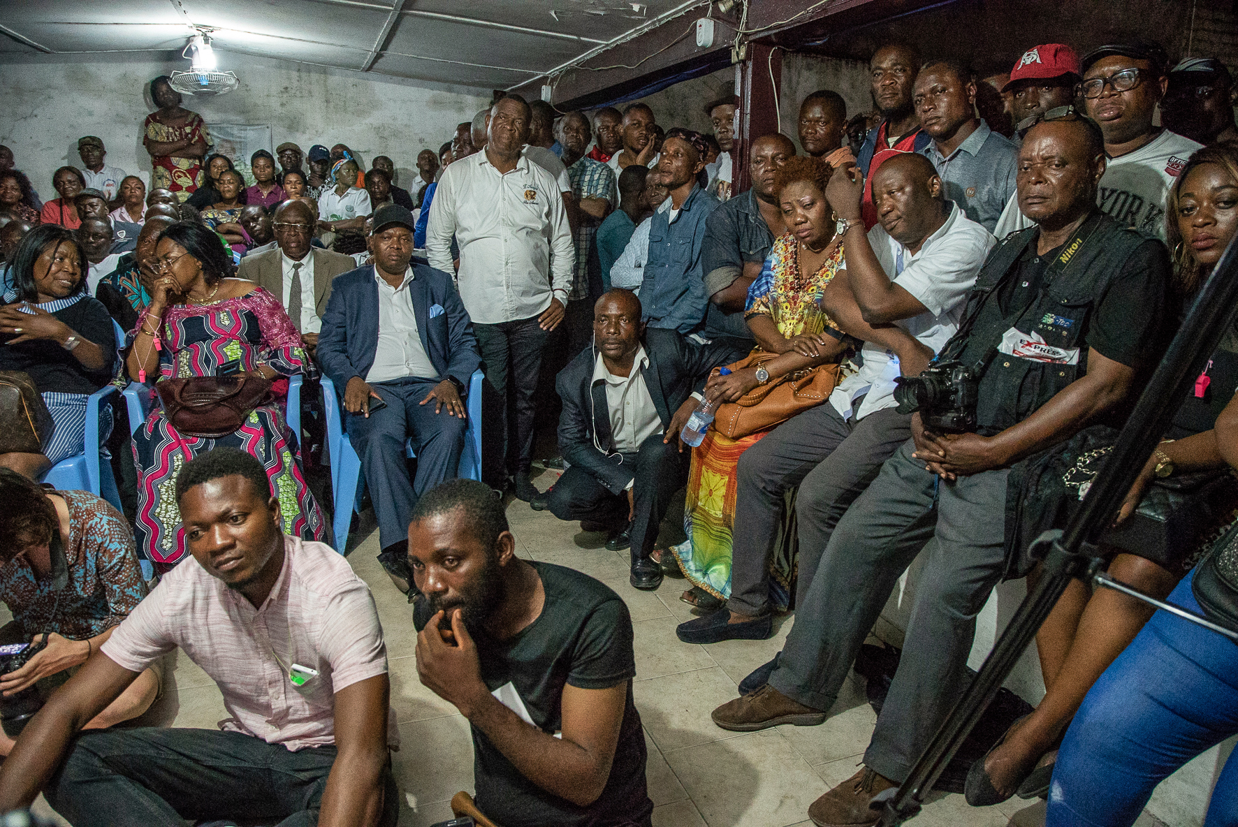 Supporters of presidential candidate Felix Tshisekedi wait for the announcement of the provisional results of the presidential election by the Independent National Electoral Commission (CENI) at the former residence of the candidate's father, Etienne Tshisekedi, a Congolese political opponent who died in February of 2017, in Kinshasa on January 10th, 2019.