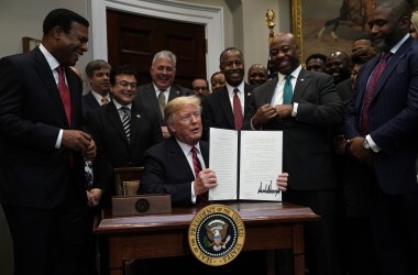 President Donald Trump signs an executive order in December of 2018 to establish the White House Opportunity and Revitalization Council to oversee the opportunity zones program.