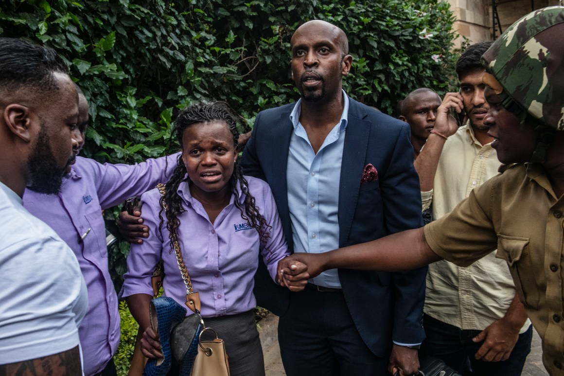 A woman reacts after being rescued from the Dusit Hotel on January 15th, 2019, in Nairobi, Kenya. A security operation is underway after terrorists attacked the hotel.