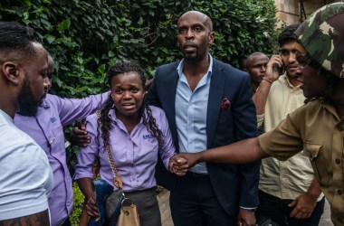 A woman reacts after being rescued from the Dusit Hotel on January 15th, 2019, in Nairobi, Kenya. A security operation is underway after terrorists attacked the hotel.