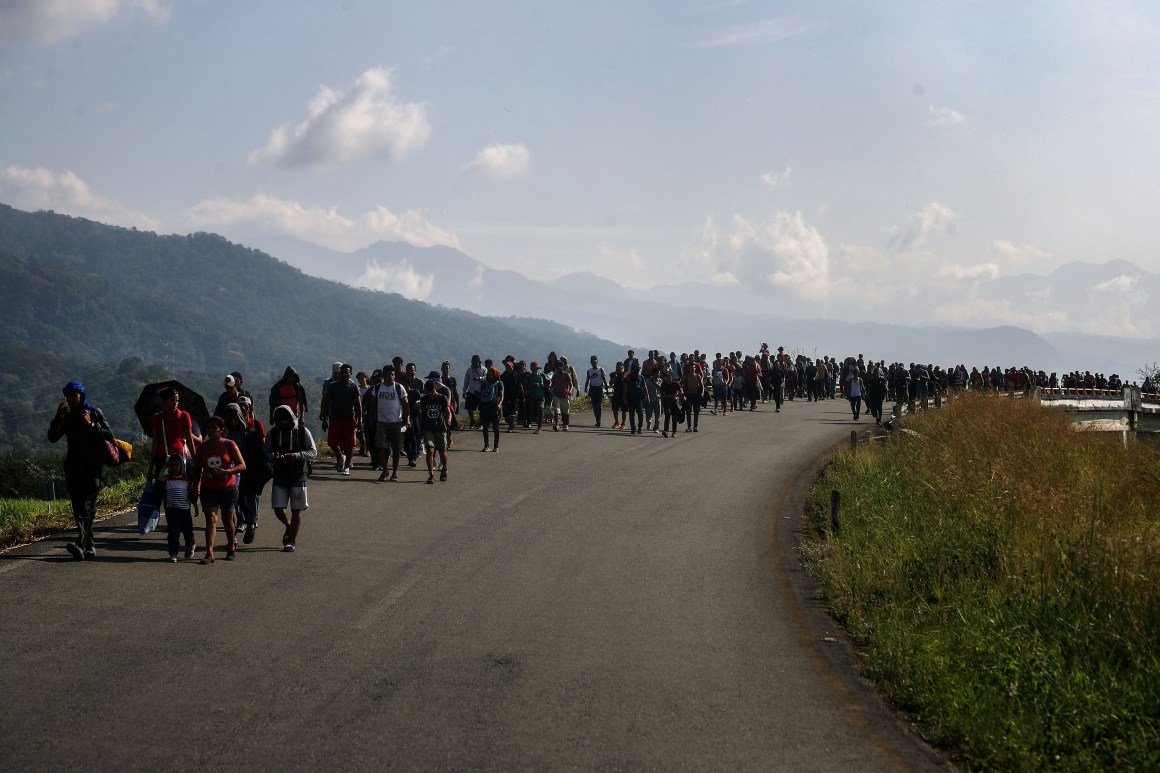 Members of a caravan of Central American migrants walk along a highway on their way toward the United States on January 20th, 2019, in Huixtla, Mexico.