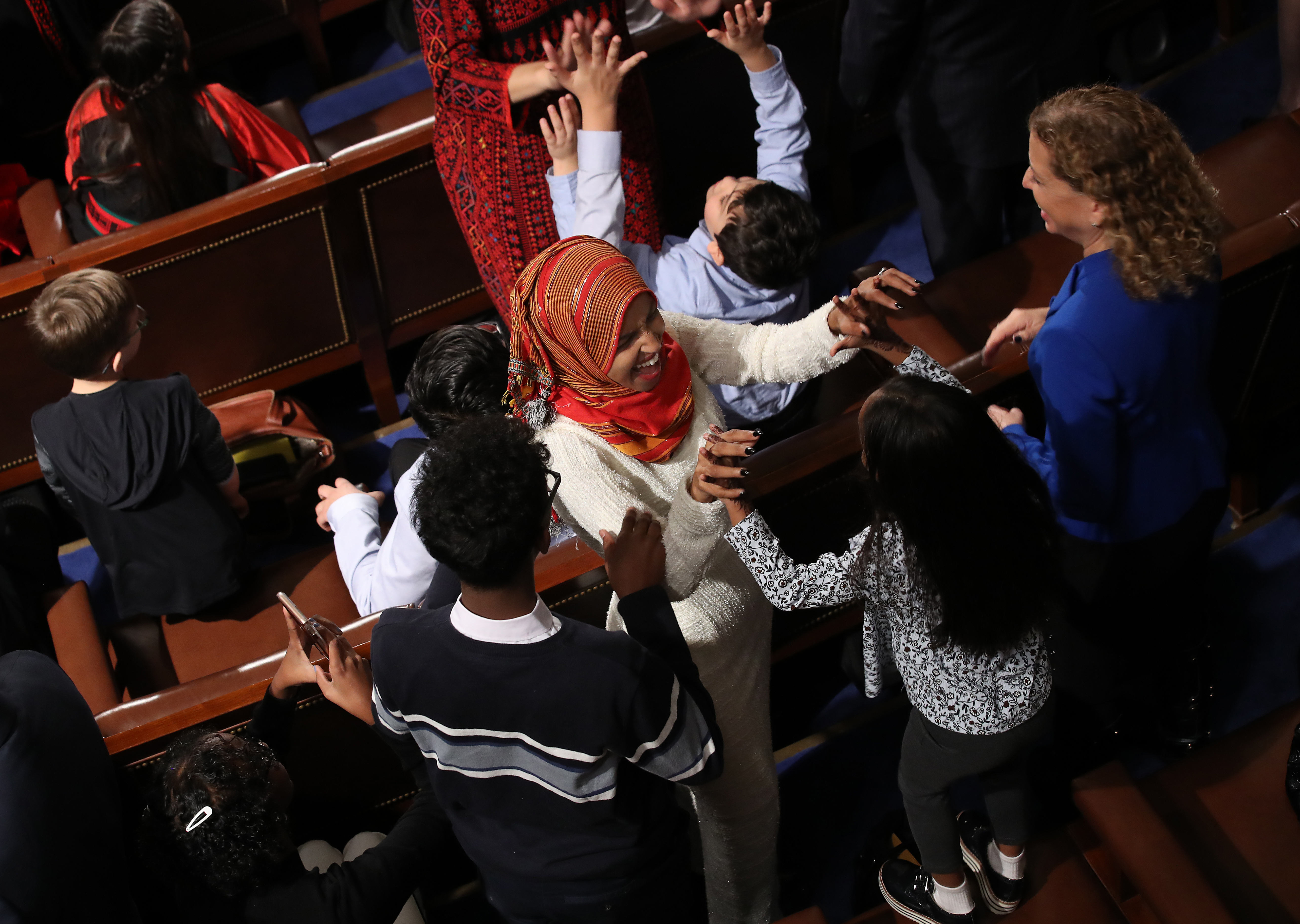 Newly elected Representative Ilhan Omar (D-Minnesota) celebrates with her children after taking the oath of office during the first session of the 116th Congress at the U.S. Capitol January 3rd, 2019, in Washington, D.C.