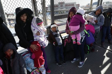 People wait at the Paso Del Norte Port of Entry bridge to turn themselves in to U.S. Customs and Border Protection personnel for asylum consideration on January 13th, 2019, in Ciudad Juarez, Mexico.