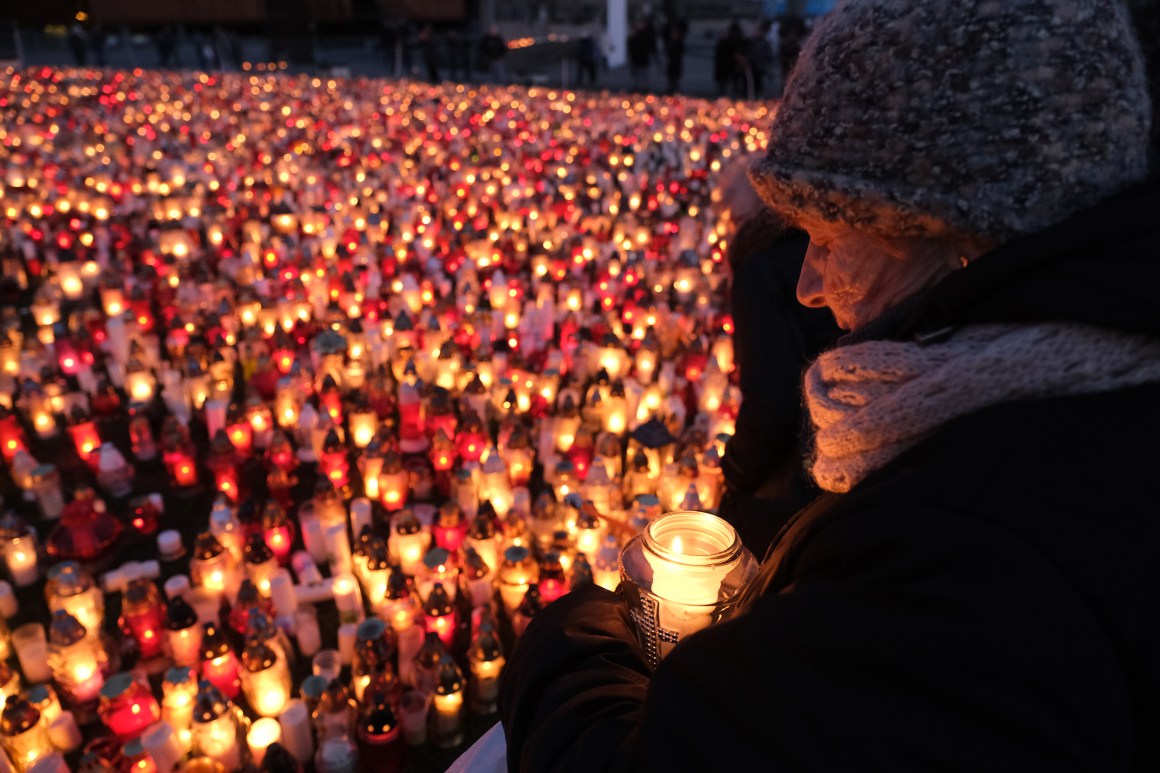 A mourner holds a candle for murdered Gdansk Mayor Pawel Adamowicz on January 17th, 2019, in Gdansk, Poland. Adamowicz was stabbed on stage while attending a charity event in Gdansk last Sunday and died a day later of his injuries. The suspect is a 27-year-old man with a criminal record who was taken into custody. The coffin carrying Adamowicz's body was displayed in the European Solidarity Centre late Thursday, where the public could pay last respects. Adamowicz's funeral is scheduled for Saturday, January 19th, 2019.