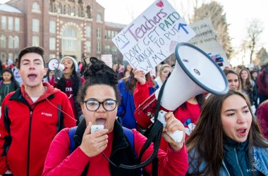 South High School seniors Johnny Hultzapple (left), Aislinn Thompson (center), and Esperanza Soledad Garcia (right) lead students on a walkout to join their striking teachers on the picket line on February 11th, 2019, in Denver, Colorado. Denver teachers are striking for the first time in 25 years after the school district and the union representing the educators failed to reach an agreement following 14 months of contract negotiations over teacher pay.