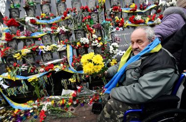 An activist pays tribute at a memorial for the more than 100 Maidan activists who were killed during the 2014 Ukranian revolution, at a memorial event near Independence Square in Kiev, Ukraine, on February 20th, 2019. Ukraine is marking the fifth anniversary of the bloody end to the revolution that ousted Russian-backed president Viktor Yanukovych between February 18th and February 20th, 2014.