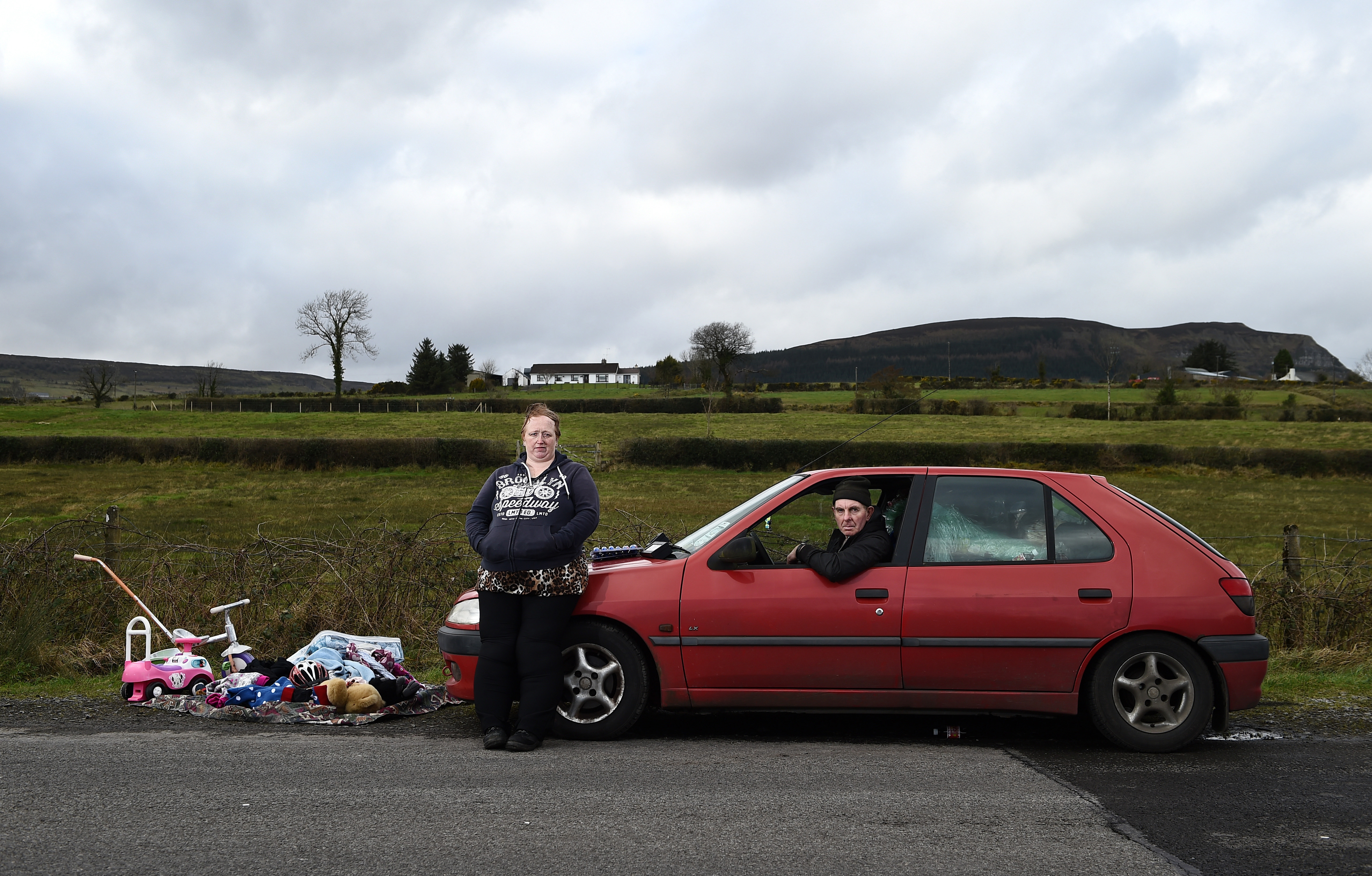 Stella Lynne and William Andrews pose for a photograph as they take part in the weekly market that takes place on the Irish border on February 17th, 2019, in County Fermanagh, Northern Ireland. The couple, who are Democratic Unionist Party voters, voted to remain in the E.U. Referendum in 2016 and now fear the return of a hard border. 