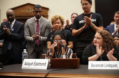 Aalayah Eastmond, a survivor of the mass shooting at Marjory Stoneman Douglas High School in Parkland, Florida, wipes away tears as she receives a standing ovation while testifying to the House Judiciary Committee on February 6th, 2019.