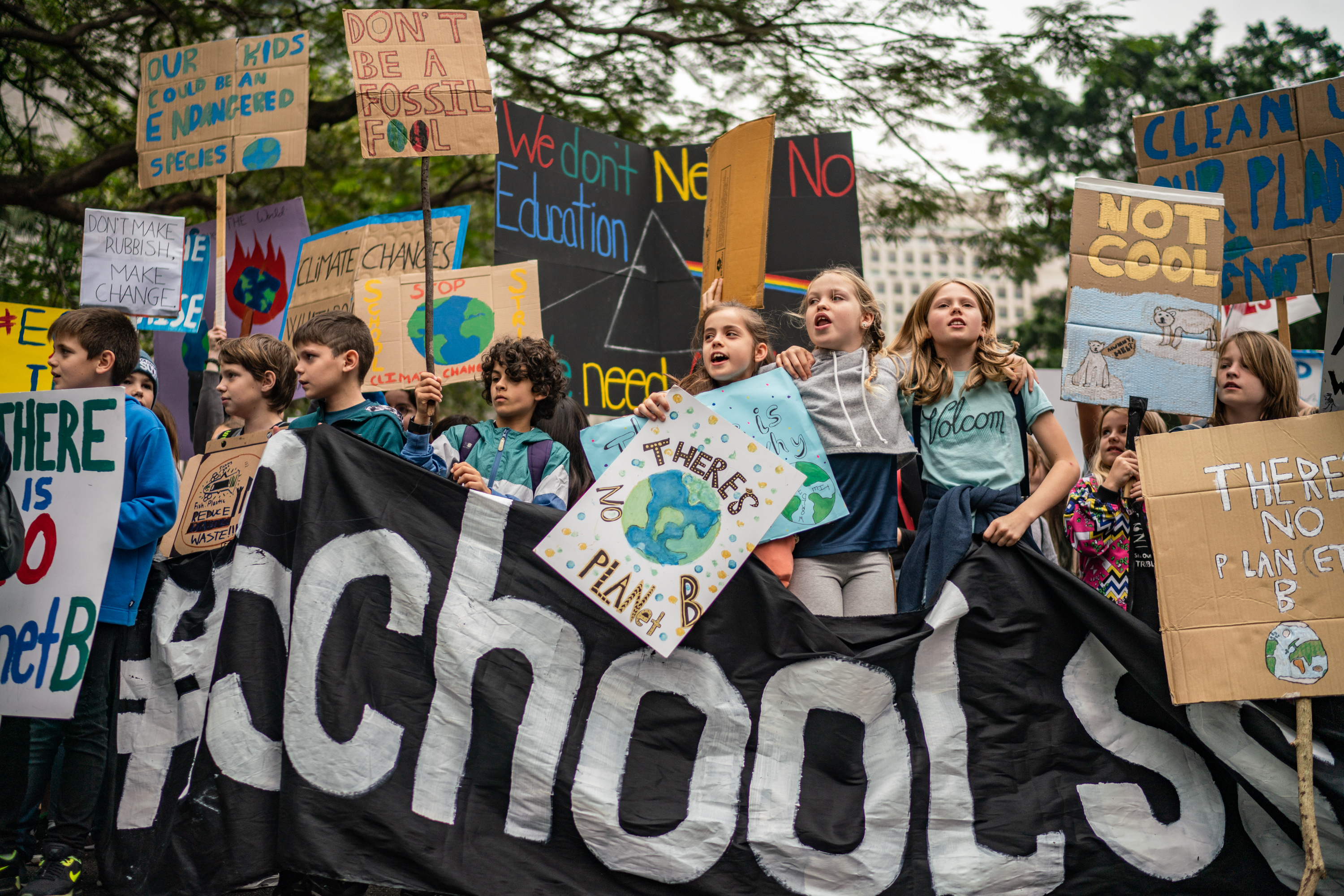 Students hold placards and shout slogans as they participate in a protest on March 15th, 2019, in Hong Kong.