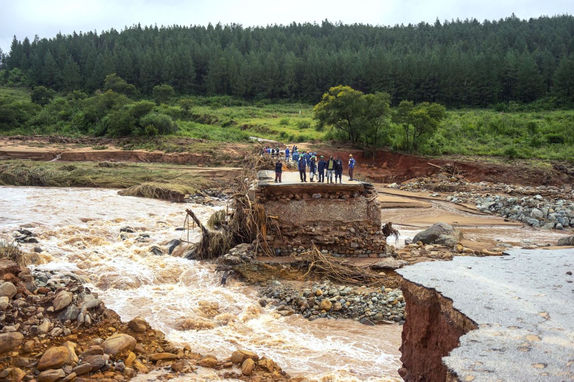 Timber company workers stand stranded on a damaged road on March 18th, 2019, at Charter Estate, in Chimanimani, eastern Zimbabwe, after Cyclone Idai ripped across Mozambique, Zimbabwe, and Malawi. The Red Cross has reported at least 215 deaths, and President Filipe Nyusi of Mozambique said he fears the death toll may reach over 1,000. Cyclone Idai tore into the center of Mozambique on the night of March 14th before barreling into neighboring Zimbabwe, bringing flash floods and ferocious winds, and washing away roads and houses.